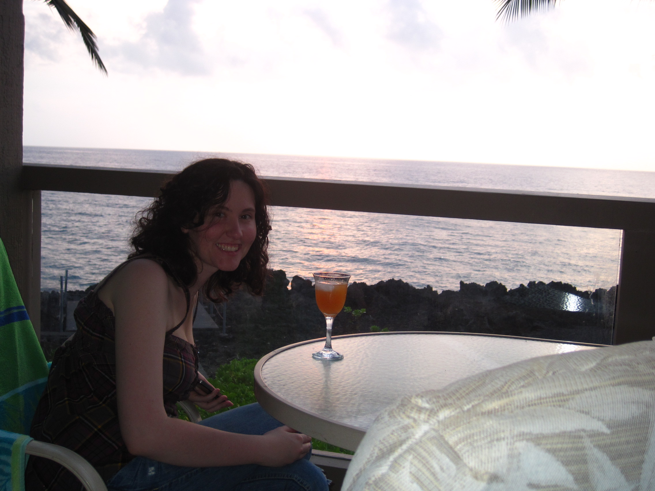 Kelly is enjoying some POG (Passion Orange Guava) and champage while  watching the sunset.