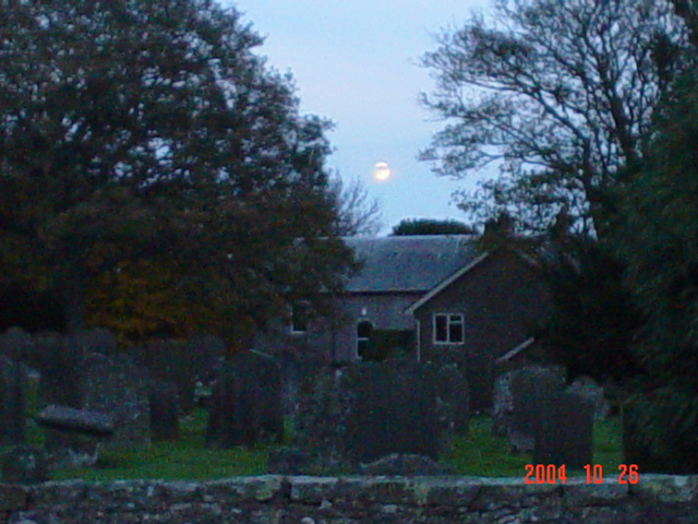 The moon rising over the cemetary