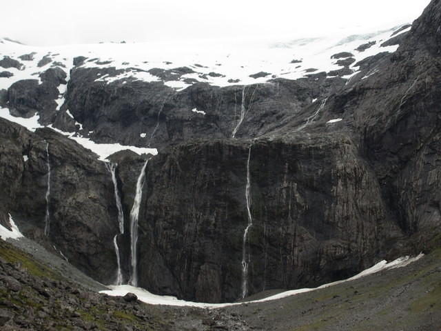 We started to walk out towards these falls near Homer Tunnel, but the incredibly strong winds made us turn back.
