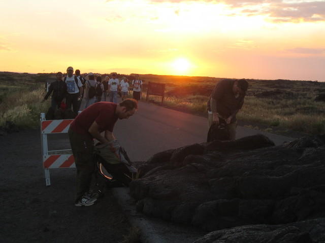 Mickey and Andrew prepare for a hike across the lava flows as the sun sets.