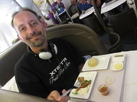 Enjoying our meal in business class