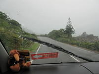 Driving along the coast in the rain.