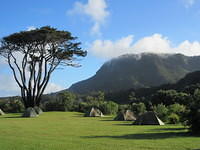 A beautiful campground with the mountains of Paparoa in the background.