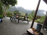 Enjoying reading Unbroken and sipping some New Zealand Earl Grey under an awning while it rains.