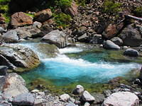 Yes, the river is teal.  Even more beautiful in real than this picture show.