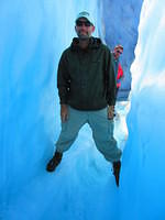 Walking a narrow ridge above a glacier river.  Don't fall in!