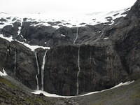 We started to walk out towards these falls near Homer Tunnel, but the incredibly strong winds made us turn back.
