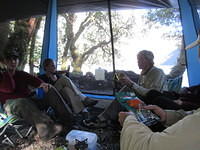 Hanging out preparing food, eating, chatting, and doing the Tam Tam Slam.  The Tam Tam Slam involved eating the corners off of a Tam Tam (New Zealand cookie), then sucking hot chocolate through the cookie, then popping it into your mouth before the coo...