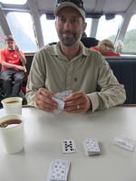 Playing cards during the boat ride back to Manapouri.