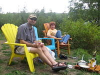 Mickey and Angie enjoying wine by the creek